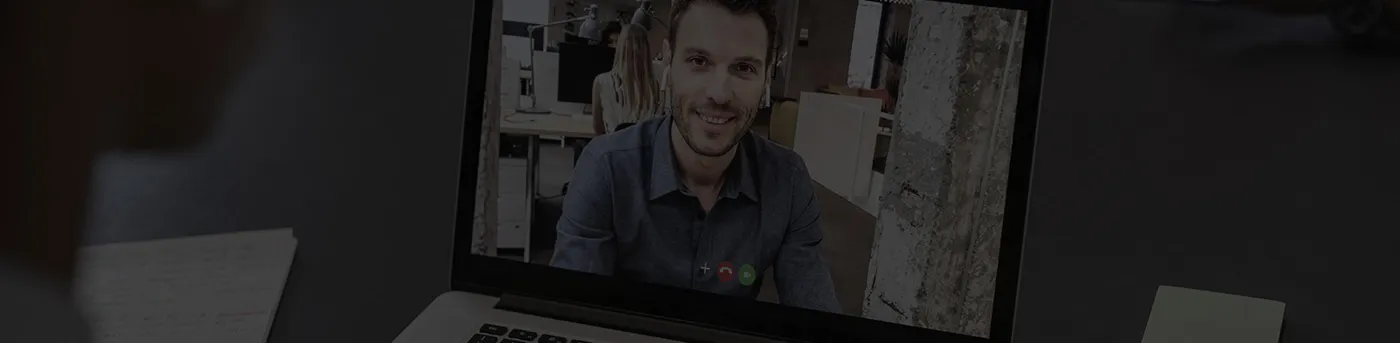 Laptop showing a video call, banner for contacting Wahal Engineers