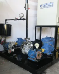 Wahal bitumen emulsion skid with blue motor-driven pumps, feed tank and pressure gauge