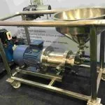 Wahal solid-liquid induction mixer with powder hopper on a wheeled stainless steel frame