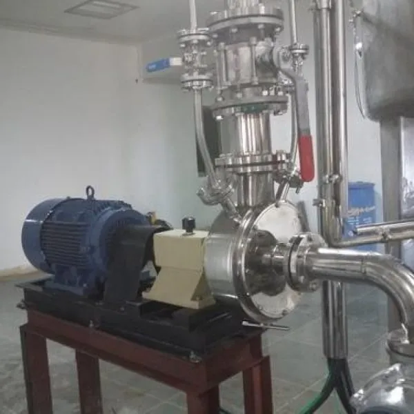 Inline high shear mill with blue motor connected to stainless steel process piping