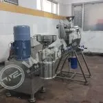 Wahal multiprocessor wet grinder with feed hopper beside a stainless steel vessel on a stand