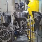 Wahal conical-bottom mixing vessel with inline mixer and two feed hoppers in a liquid oral plant