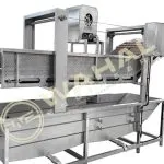 Wahal vegetable washing machine with perforated conveyor above a stainless steel wash tank