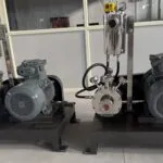 Two Wahal inline high shear mills with seal support vessels and motors on steel base frames