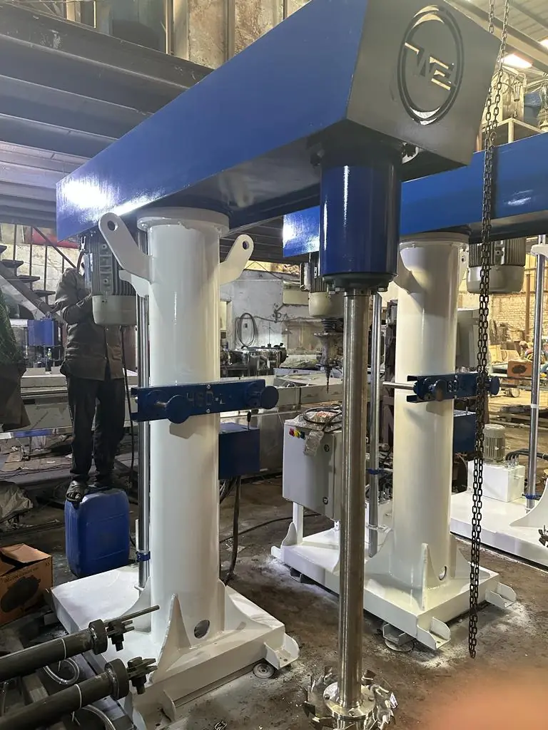 High speed disperser with twin white lift columns being assembled in a workshop