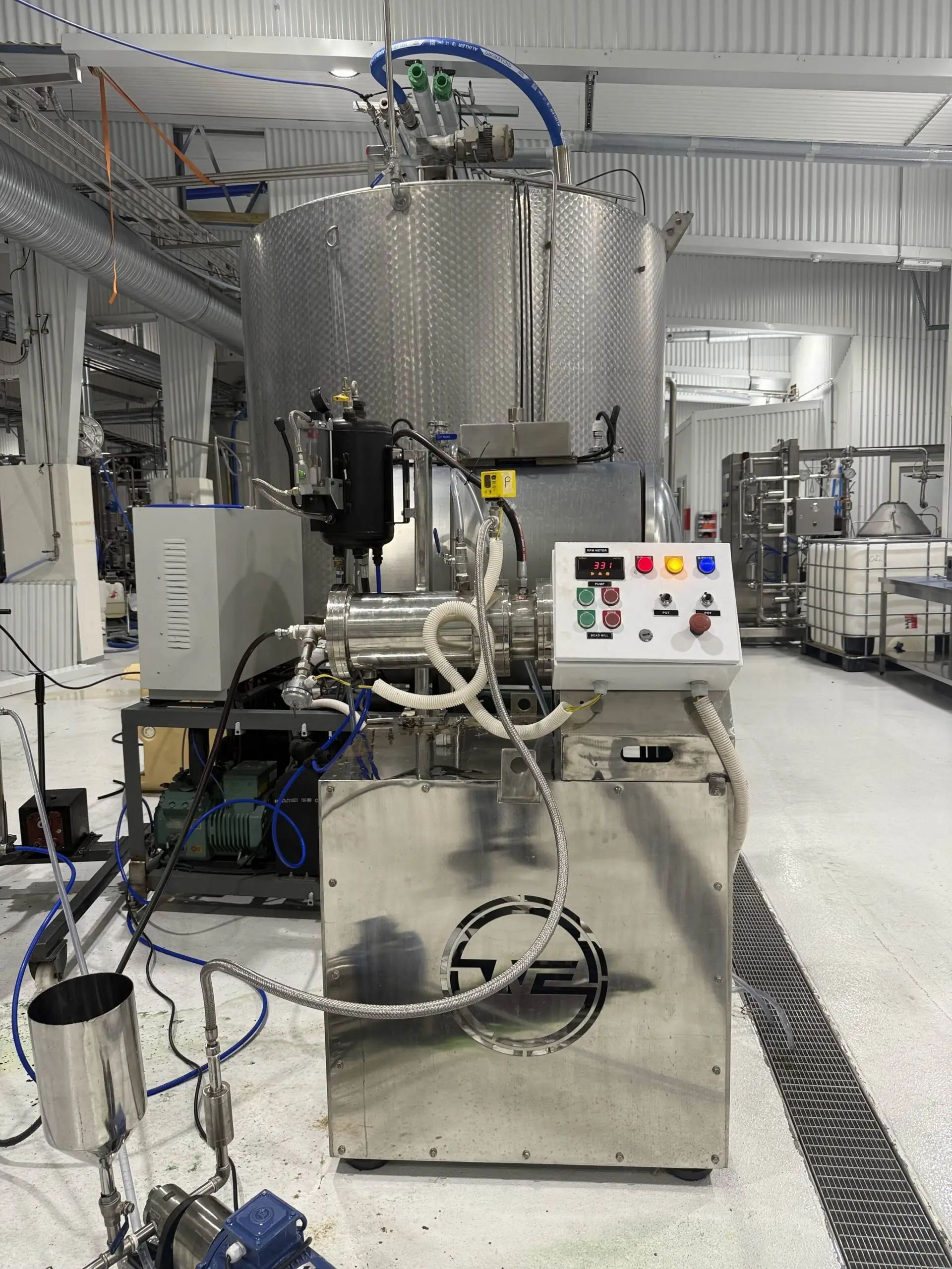 Wahal horizontal bead mill with digital control panel, chiller and feed pot on a factory floor
