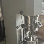 Wahal double planetary mixer with the mixing head raised above its stainless steel bowl on a wheeled frame